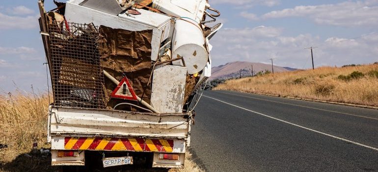 Truck with a heap of appliances and items