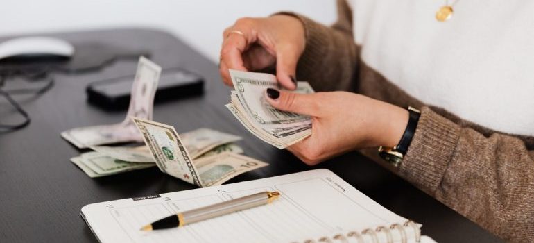 Person counting money.