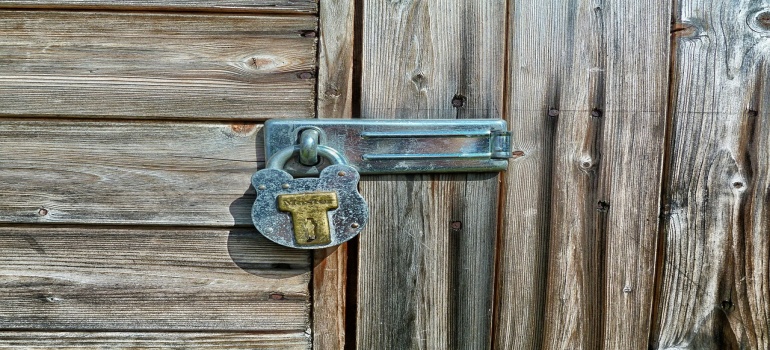 A lock on a shed posing risks of DIY storage alternatives