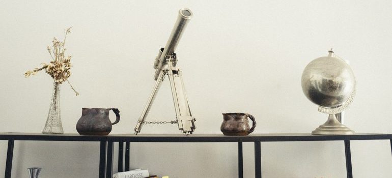 A desk filled with different decorative objects