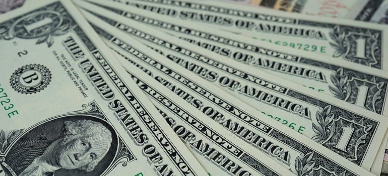 Dollar bills to pay for self-storage Shoreline.