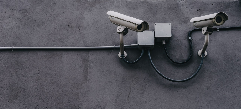 security cameras on a gray wall