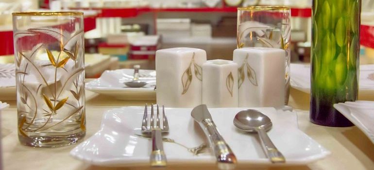 A table filled with glass items.