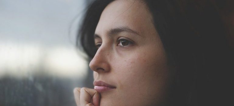 A woman thinking about the future of storage solutions.