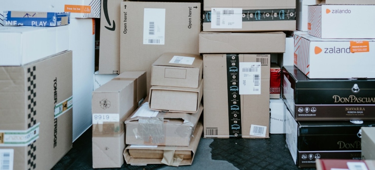brown cardboard boxes on black plastic crate