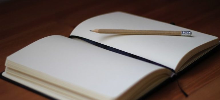 an empty notebook and a pen