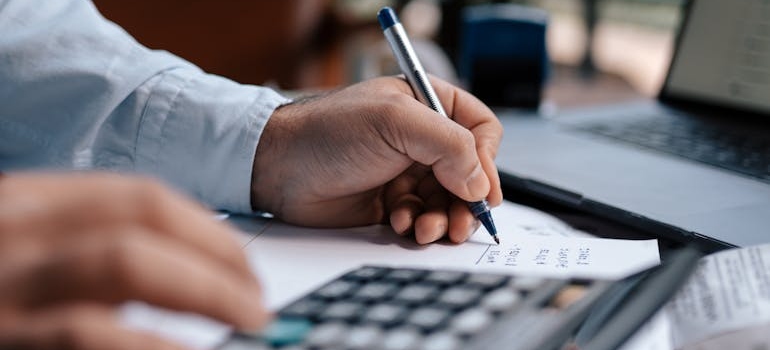 A person using a calculator