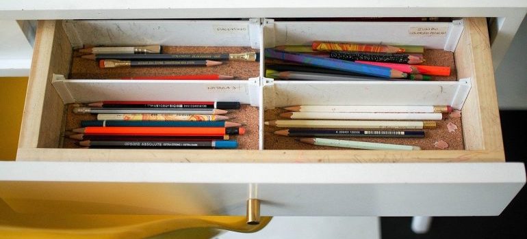 Pens inside a drawer.