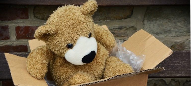 A teddy bear in a box.