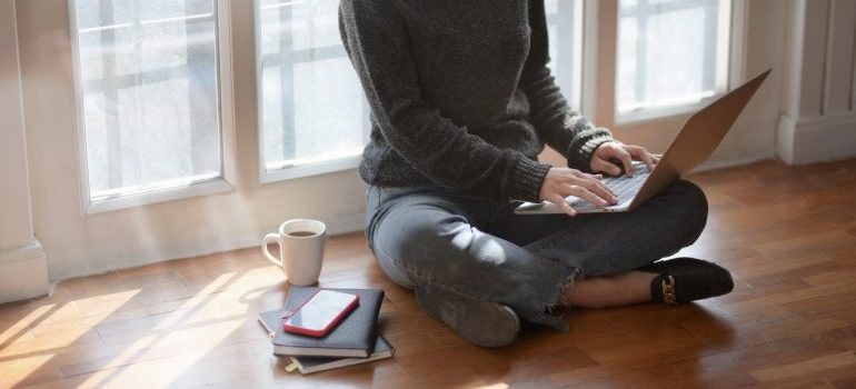 woman reading about the top businesses that use self-storage