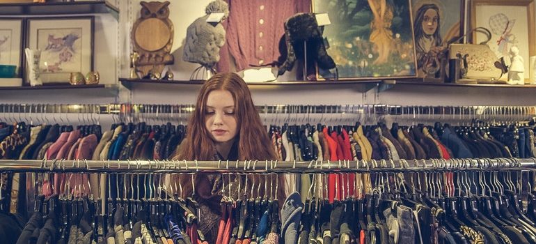 Person browsing a second hand shop.