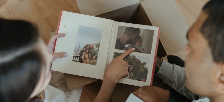 Man and woman looking at family album