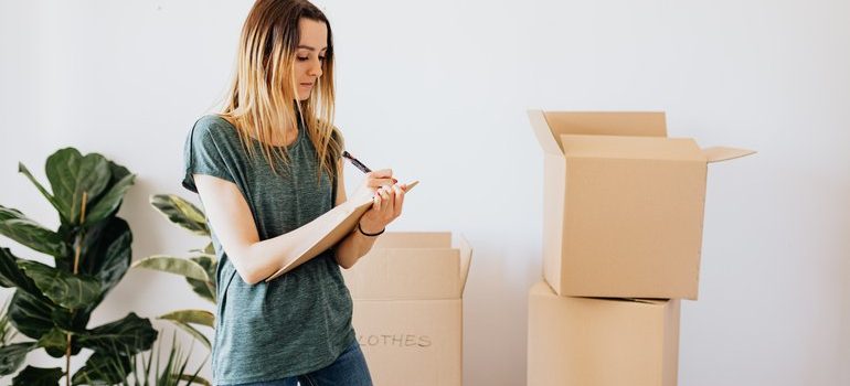 Person packing for a move.