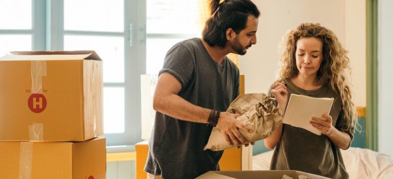 Couple packing for move