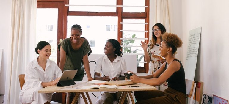 A group of workers enjoying the benefits of storage for retail businesses.