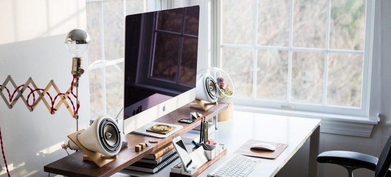 A desk full of electronic devices.