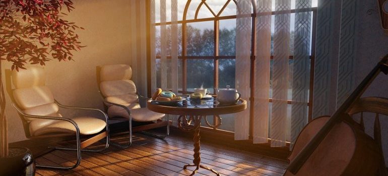 Two armchairs next to a table.