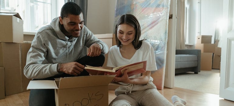 A man and a woman looking at photos after using self-storage while deployed.