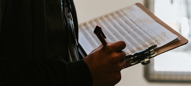 Close-up shot of a person doing a checklist