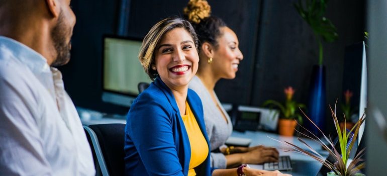 Three people in an office.