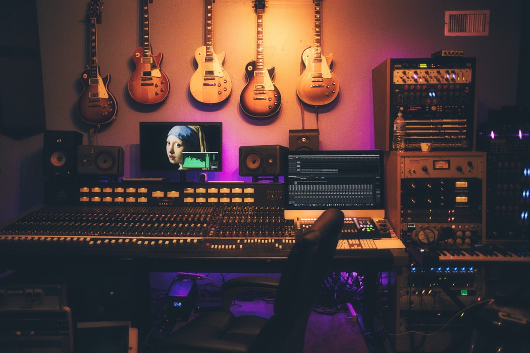 A music studio in low colorful light.
