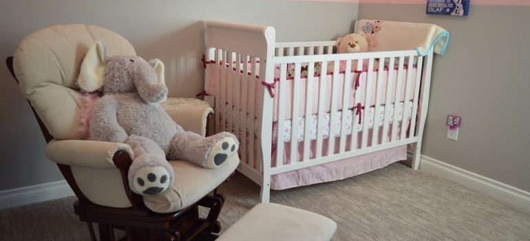 Baby girl nursery items in a room