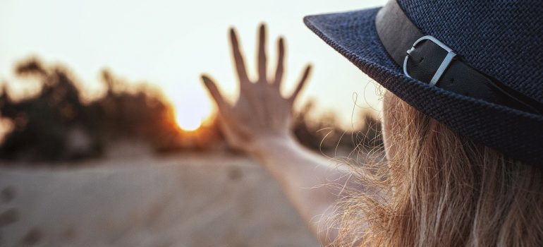A woman holding out an open hand.