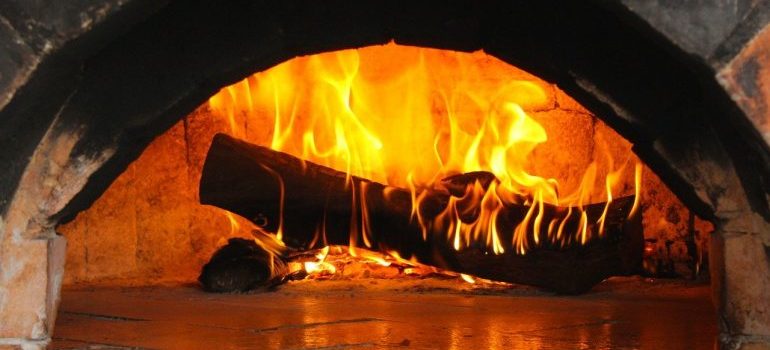 A log burning in a furnace.