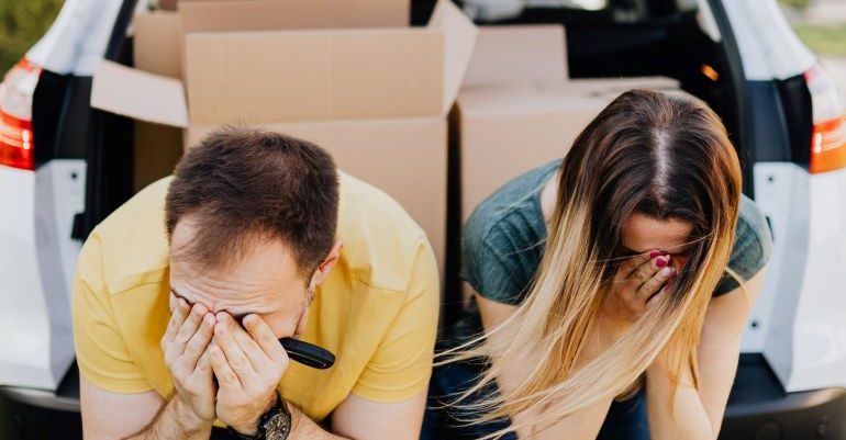 Two people frustrated with having to search for self storage solutions for all their boxes.