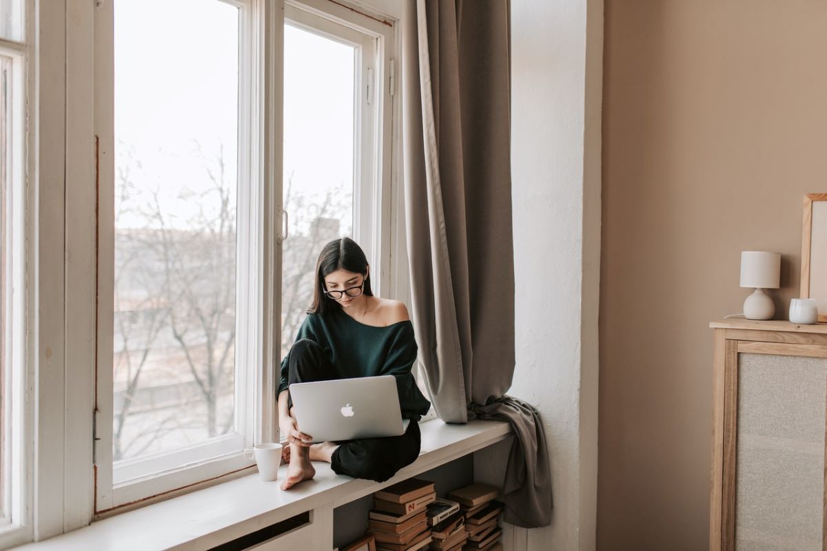 A woman reading tps for first-time storage renters on her laptop