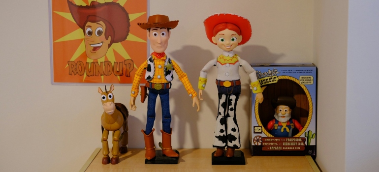 Several Toy Story collectible dolls on a shelf