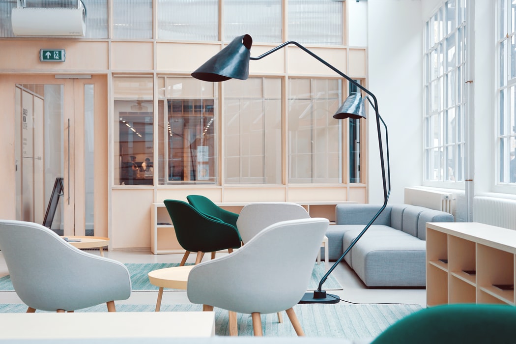 Office space with chairs, cabinets and lamps.