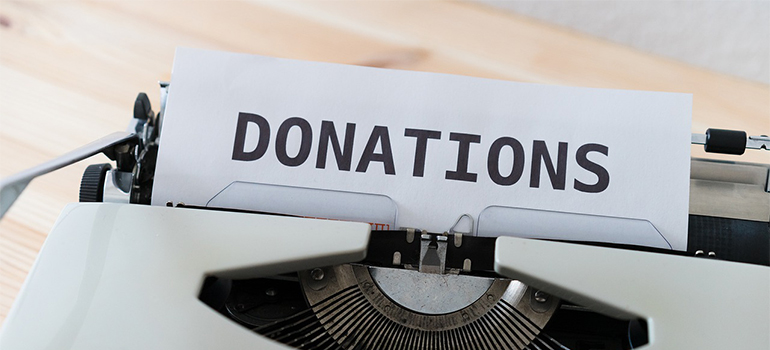 a paper with a word donations on it