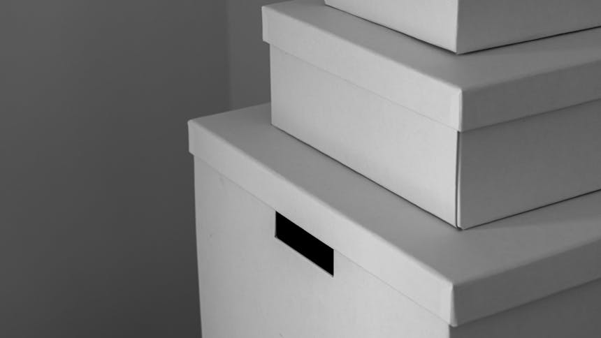 Three white boxes stacked
