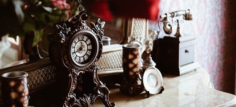 Round black analog deck clock