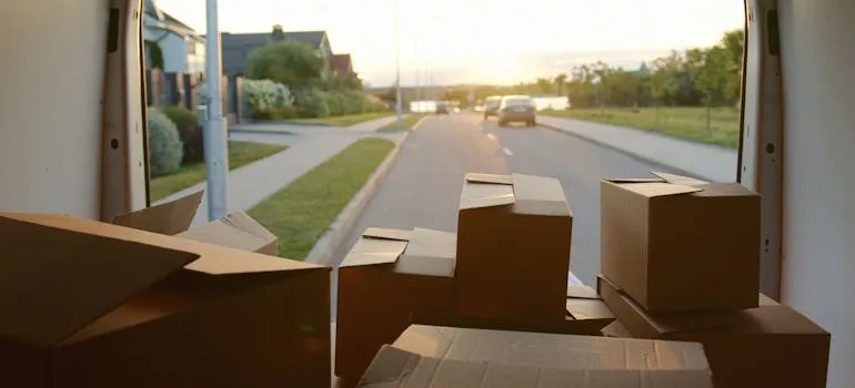 Boxes in a mini van with open doors