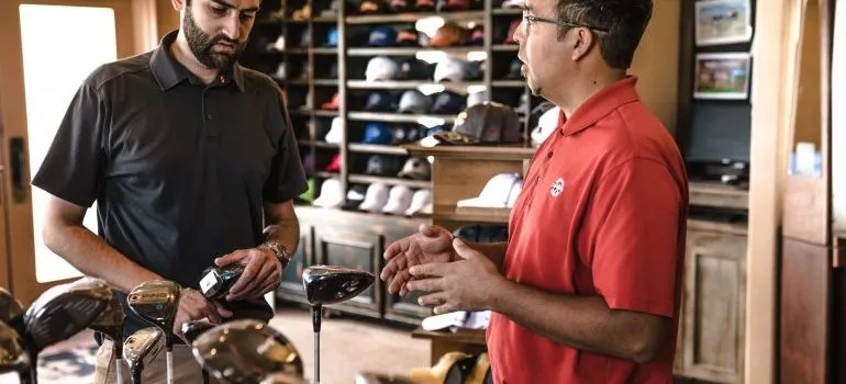 Two guys in a golf equipment store