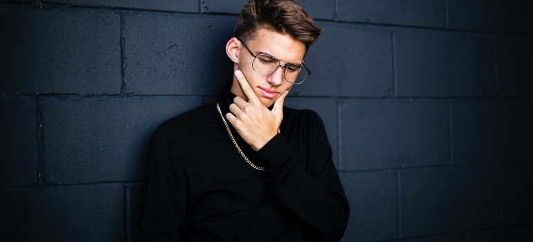 a man thinking about storing a flat screen TV