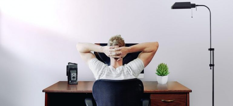 person sitting in his home office