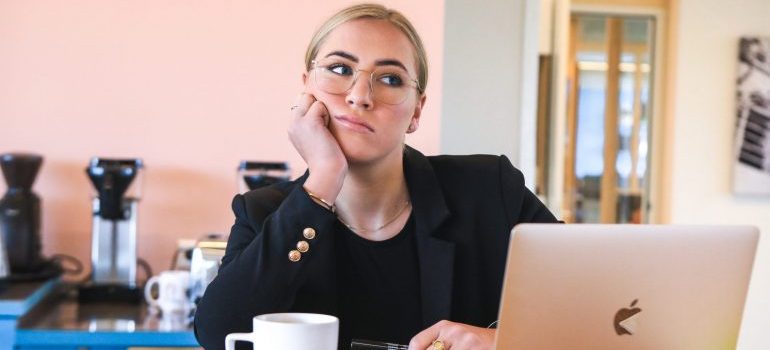unhappy woman working on her laptop