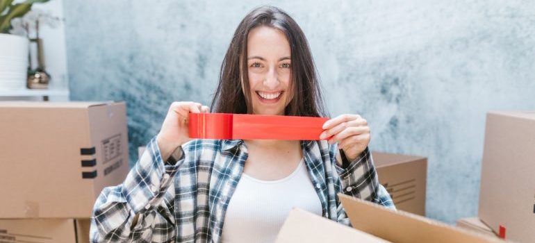 Woman getting ready to pack after learning about the best time to store away summer items