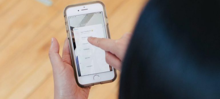 A person scrolling through reviews on a phone 