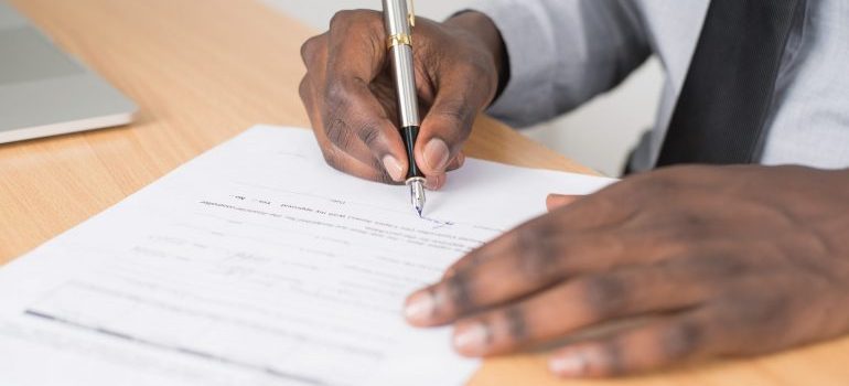 person signing a storage contact