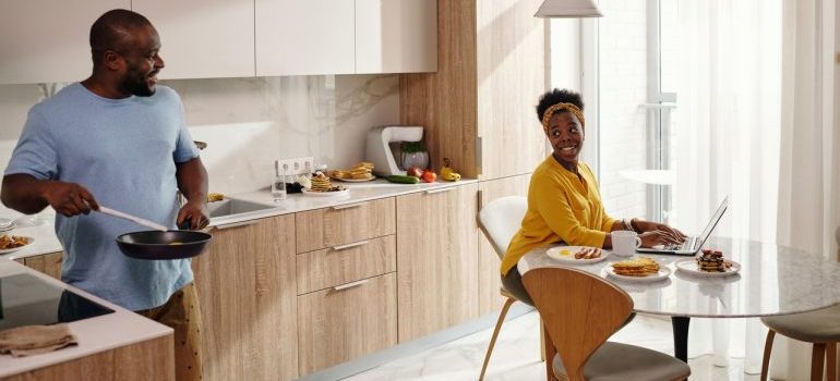 a couple having a breakfast in the kitchen 