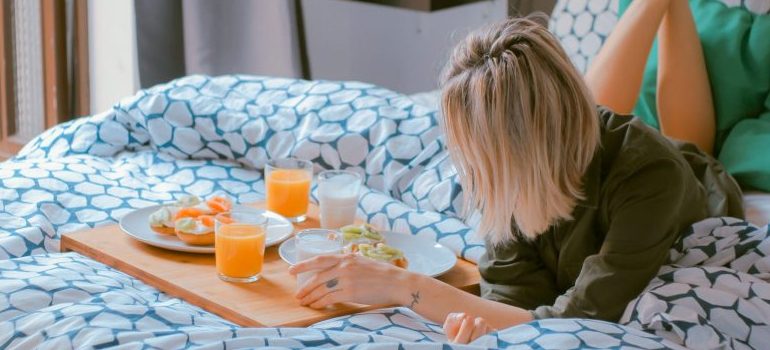person having breakfast on the bed