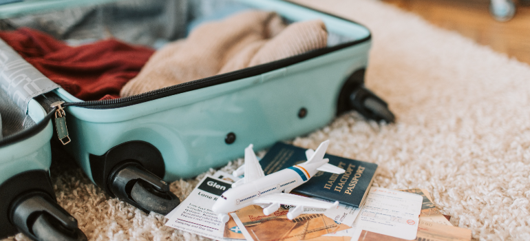 blue suitcase with travel documents