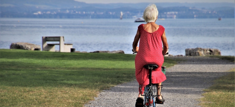 elderly person riding a bicycle