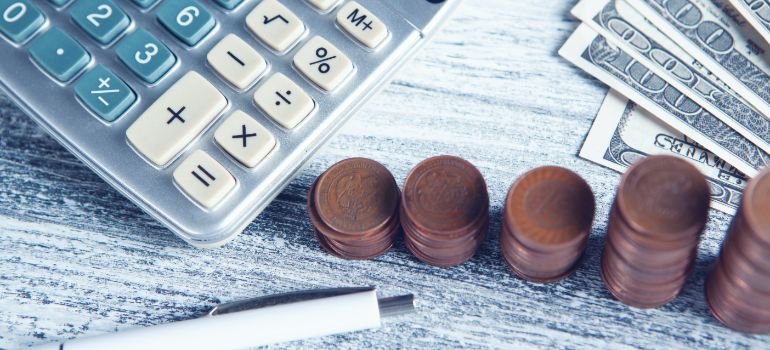 coins and a calculator on a table