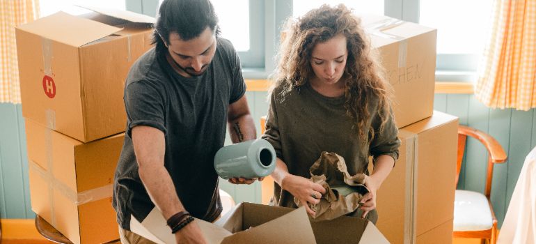 two people packing their home for portable storage