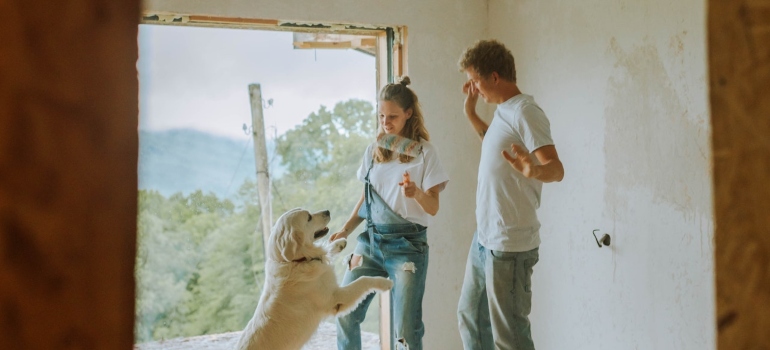 A man and a woman are renovating a house to save by selling their Seattle home.